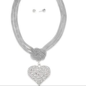 Silver braided necklace with heart pendant